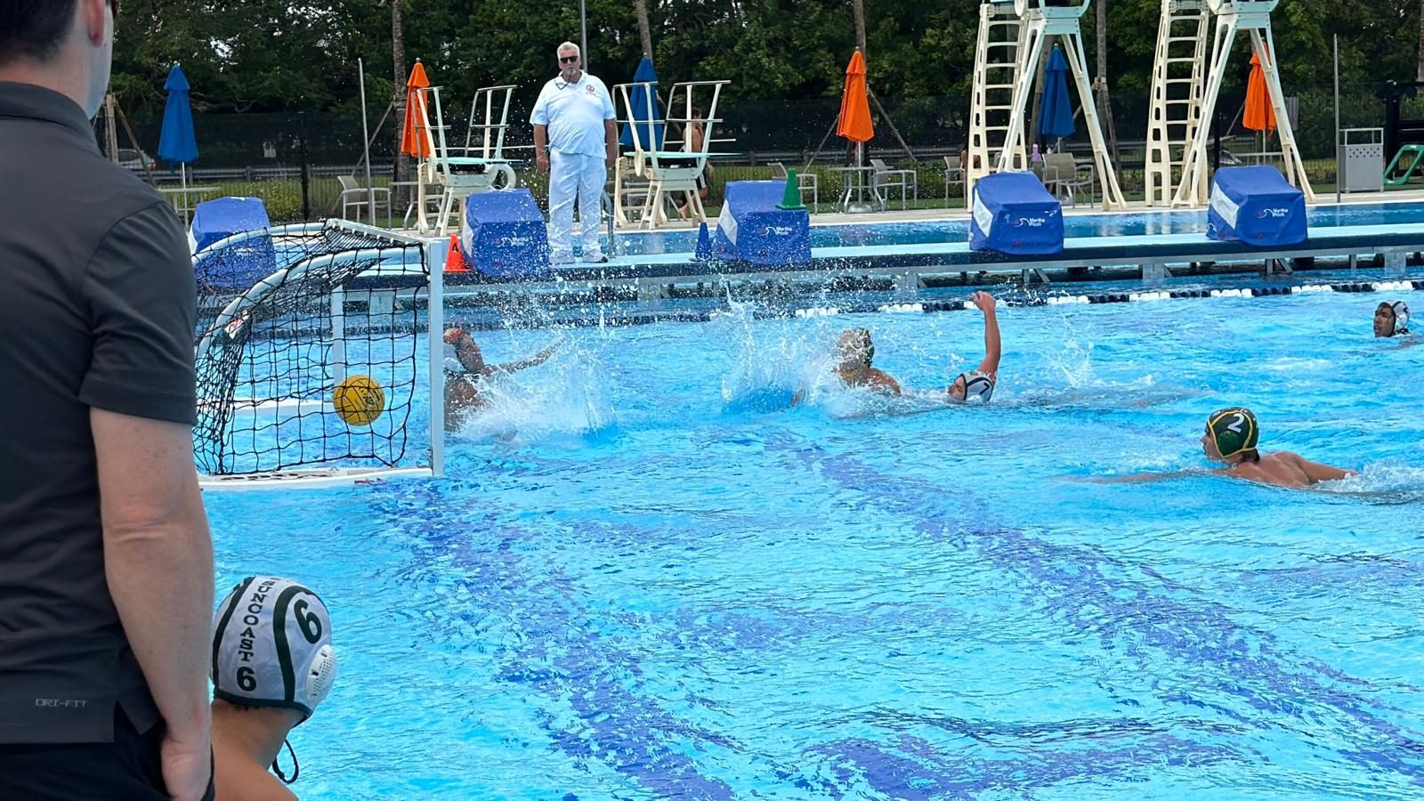 Suncoast water polo player defending near the goal